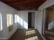 Sunroom featuring a ceiling fan, shelving and multiple windows at 3345 W Laurel Ln, Phoenix, AZ 85029