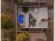 An aerial view shows the house has a great roof and pool at 3459 E Mockingbird Dr, Gilbert, AZ 85234