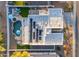 A bird's-eye view shows a home with a private backyard that includes a custom in-ground pool and outdoor seating area at 3459 E Mockingbird Dr, Gilbert, AZ 85234