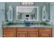 Bathroom vanity with marble countertop, vessel sink, and modern lighted mirrors and fixtures at 3459 E Mockingbird Dr, Gilbert, AZ 85234