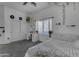 Well lit bedroom featuring ivy decor, white decor, carpeted flooring, and a ceiling fan at 3459 E Mockingbird Dr, Gilbert, AZ 85234