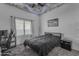 Monochromatic bedroom featuring a dramatic cloud ceiling design and large window at 3459 E Mockingbird Dr, Gilbert, AZ 85234