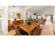 Cozy dining room with hardwood floors and a view into the bright, open living area at 3648 N 162Nd Ave, Goodyear, AZ 85395