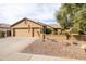 Well-maintained home with a three-car garage, desert landscaping, and excellent curb appeal at 3648 N 162Nd Ave, Goodyear, AZ 85395