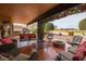 Wide shot of patio showcasing outdoor furniture and landscaped yard at 3648 N 162Nd Ave, Goodyear, AZ 85395