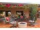 Comfortable patio set with surrounding greenery and small fire pit at 3648 N 162Nd Ave, Goodyear, AZ 85395