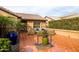 Cozy patio featuring tiled floors, comfortable seating, and decorative plants, ideal for enjoying the outdoors at 3648 N 162Nd Ave, Goodyear, AZ 85395