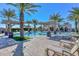 Inviting community pool area with lounge chairs and lush landscaping creates a resort-like atmosphere at 3648 N 162Nd Ave, Goodyear, AZ 85395