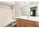 Bathroom with a tub-shower combo and a wood vanity at 3708 E Bruce Ave, Gilbert, AZ 85234