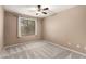 Bedroom with carpet, window, and neutral paint at 3708 E Bruce Ave, Gilbert, AZ 85234