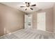 Bedroom with carpet, neutral color and a ceiling fan; bathroom access is nearby at 3708 E Bruce Ave, Gilbert, AZ 85234