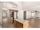 Kitchen with stainless refrigerator, wood cabinets and access to additional living space at 3708 E Bruce Ave, Gilbert, AZ 85234