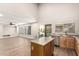 Open concept living space adjacent to kitchen with an island and stainless appliances at 3708 E Bruce Ave, Gilbert, AZ 85234