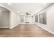 Empty living room with neutral walls, wood floors, recessed shelves, and plenty of natural light at 3708 E Bruce Ave, Gilbert, AZ 85234