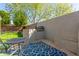 Outdoor kitchen with grill, counter space, seating, and a blue outdoor rug at 3708 E Bruce Ave, Gilbert, AZ 85234