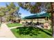 A community park with an open picnic shelter and picnic tables at 3708 E Bruce Ave, Gilbert, AZ 85234