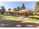 Community playground with sunshades, picnic tables, and play structures for children at 3708 E Bruce Ave, Gilbert, AZ 85234