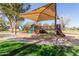 Community playground featuring slides, climbing structures, and shade in a park setting at 3708 E Bruce Ave, Gilbert, AZ 85234