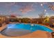 Inviting backyard pool area with ambient lighting, perfect for evening relaxation and entertaining at 3767 W Desert Creek Ln, Phoenix, AZ 85086