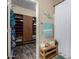 Bright bathroom featuring walk-in closet with custom shelving, decorative mermaid, and tub shower at 3767 W Desert Creek Ln, Phoenix, AZ 85086