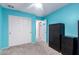 Charming blue bedroom with spacious closets, carpeted floors, and a modern dresser at 3767 W Desert Creek Ln, Phoenix, AZ 85086