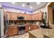 Well-equipped kitchen with stainless steel appliances, granite countertops, and ample cabinet space at 3767 W Desert Creek Ln, Phoenix, AZ 85086