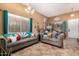 Spacious living room featuring elegant decor, tile flooring, and ample natural light at 3767 W Desert Creek Ln, Phoenix, AZ 85086