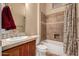 Bathroom featuring vanity with storage and a shower/tub combo at 42043 N Bradon Way, Phoenix, AZ 85086