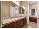 Bathroom featuring vanity with storage and a large mirror at 42043 N Bradon Way, Phoenix, AZ 85086