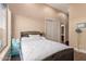 Cozy bedroom with a plush headboard, closet and window at 42043 N Bradon Way, Phoenix, AZ 85086