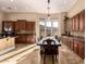 Bright dining room with a long table, ample cabinetry, and a window view of the outdoors at 42043 N Bradon Way, Phoenix, AZ 85086