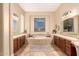 The main bath features dual sinks and a large soaking tub at 42043 N Bradon Way, Phoenix, AZ 85086