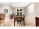 Cozy dining room with a modern table, chairs, and neutral decor at 42577 W Rosalia Dr, Maricopa, AZ 85138