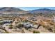 An aerial view of a custom home on a spacious lot in a desert community with surrounding mountain views at 44706 N 10Th Way, New River, AZ 85087