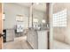 Bright bathroom featuring dual sinks, ample counter space, and a glass-enclosed shower for a spa-like experience at 44706 N 10Th Way, New River, AZ 85087