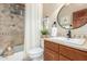 Bathroom featuring a shower and tub combination and stylish fixtures at 44706 N 10Th Way, New River, AZ 85087