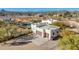 Aerial view of custom home featuring a two-car garage and mature desert landscaping at 44706 N 10Th Way, New River, AZ 85087