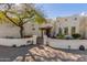 Charming desert home featuring a gated courtyard, lush landscaping, and unique architectural details at 44706 N 10Th Way, New River, AZ 85087