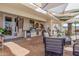 A covered outdoor kitchen features a built-in grill and counterspace, perfect for outdoor dining and entertaining at 44706 N 10Th Way, New River, AZ 85087