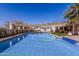 A backyard featuring a sparkling swimming pool under sunshades, perfect for relaxation and recreation at 44706 N 10Th Way, New River, AZ 85087