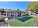 Private backyard featuring an outdoor space and artificial grass at 4506 E Arapahoe St, Phoenix, AZ 85044