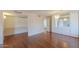 Open dining area with hardwood floors, built-in cabinets, and natural light pouring in from nearby windows at 4506 E Arapahoe St, Phoenix, AZ 85044