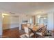 Virtually staged dining room with hardwood floors, elegant table setting and seamless flow to other spaces at 4506 E Arapahoe St, Phoenix, AZ 85044