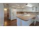 Bright kitchen featuring white cabinetry, mosaic backsplash, and stainless steel appliances at 4506 E Arapahoe St, Phoenix, AZ 85044