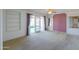 Empty main bedroom with a ceiling fan and sliding glass doors leading to the backyard at 4506 E Arapahoe St, Phoenix, AZ 85044