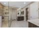 This spacious bathroom offers a walk-in shower, large vanity with double sinks, and modern neutral finishes at 4588 W Suncup Dr, San Tan Valley, AZ 85144