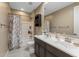 This well-lit bathroom features a tub shower, dual sinks, and spacious vanity at 4588 W Suncup Dr, San Tan Valley, AZ 85144