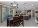 Open-concept dining area next to kitchen and living space, with backyard access at 4588 W Suncup Dr, San Tan Valley, AZ 85144