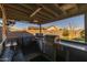 Covered outdoor kitchen with grill, countertop space, and bar seating at 4588 W Suncup Dr, San Tan Valley, AZ 85144