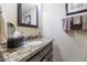 Bathroom with granite vanity, modern fixtures, and decorative mirror at 4620 N 68Th St # 116, Scottsdale, AZ 85251